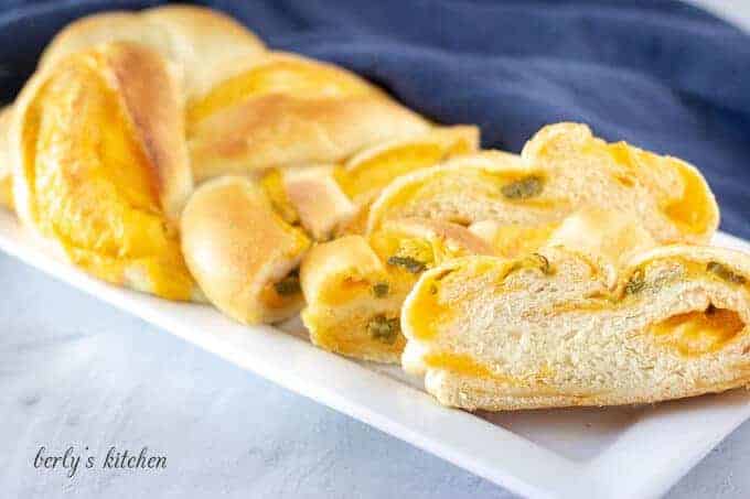 Jalapeno cheese braided bread on a white platter.