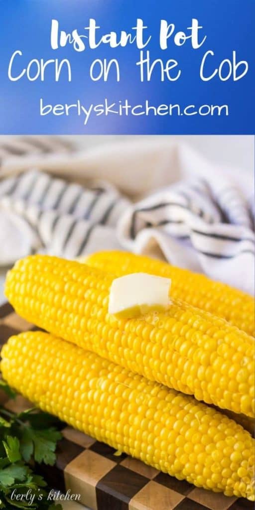 Four large ears of corn on the cob served with melted butter.