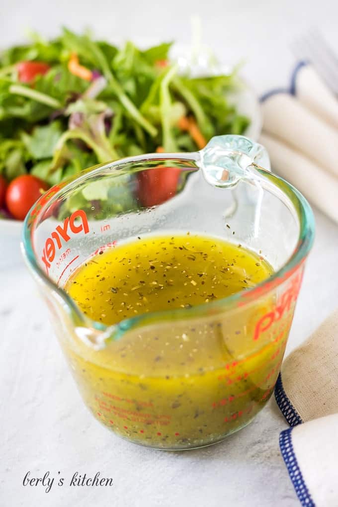 Everything in the cup has been combined to create the italian dressing.