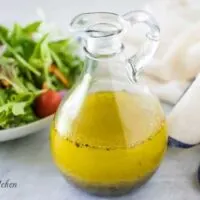 The homemade salad dressing recipe served in a glass cruet.