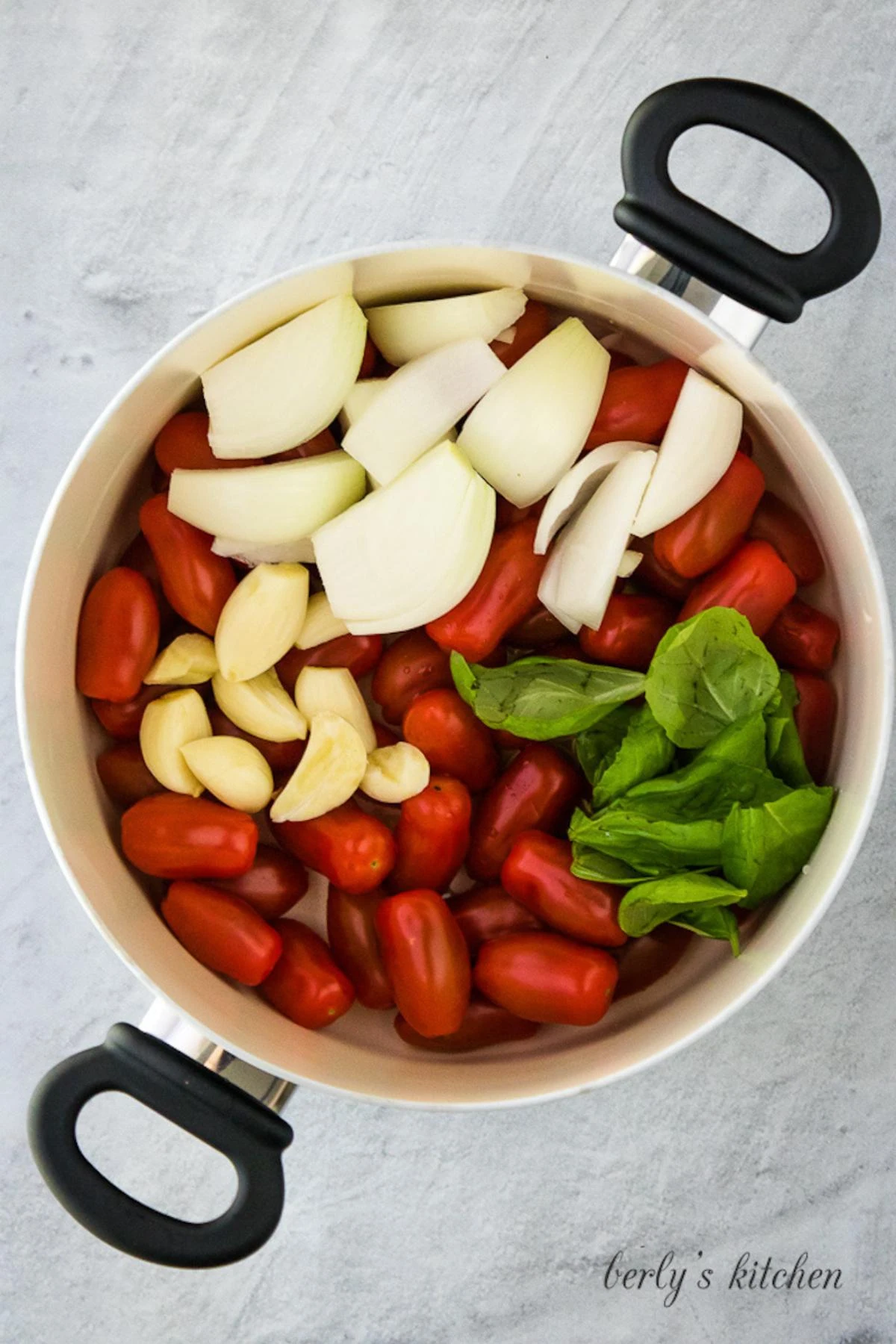 The tomatoes, onions, garlic and other ingredients is a pan.