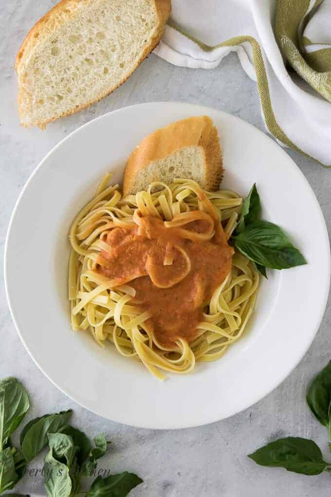 An aerial view of the bowl of pasta garnished with fresh basil.