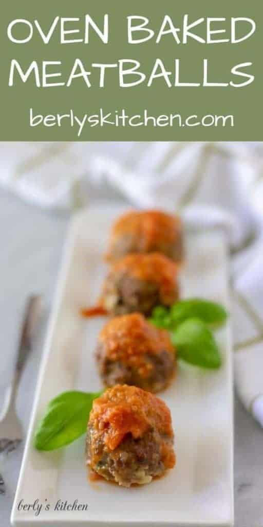 Four sauce topped oven baked meatballs garnished with fresh basil.