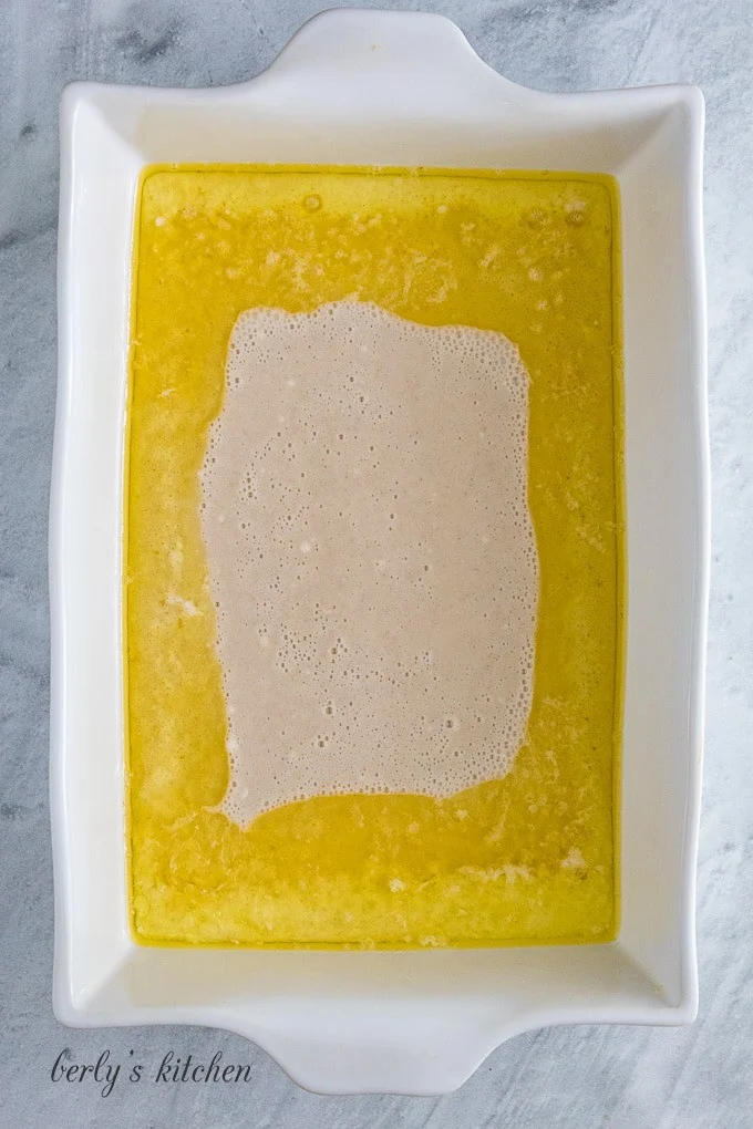 The batter has been carefully added to the melted butter.