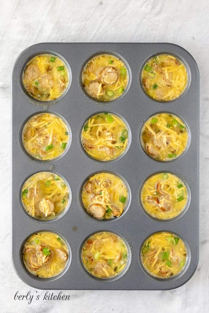 The egg mixture has been transferred to a muffin tin.