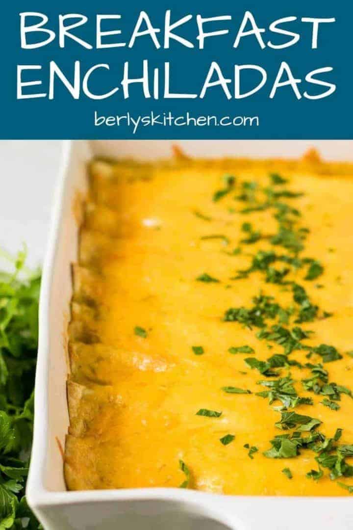 The finished cheesy breakfast enchiladas garnished with chopped fresh parsley.