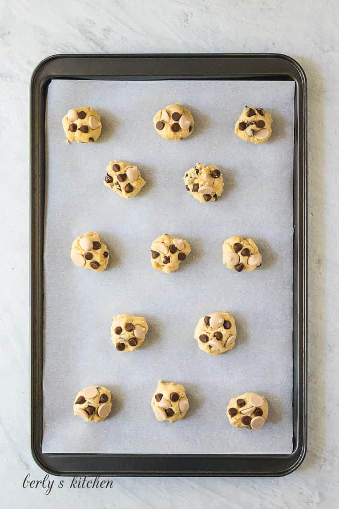 Small dough balls have been placed on a cookie sheet.