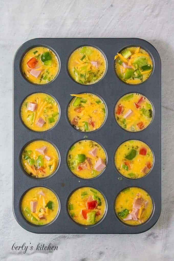 The Denver omelette ingredients have been transferred to a muffin tin.