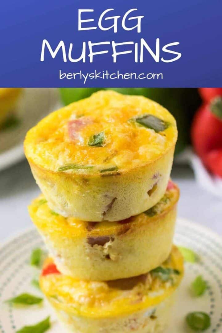 A stack of the breakfast muffins on a plate garnished with onions.
