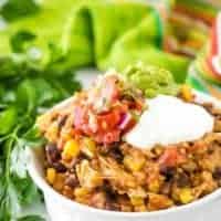 A ramekin of the chicken taco bowls topped with guacamole.