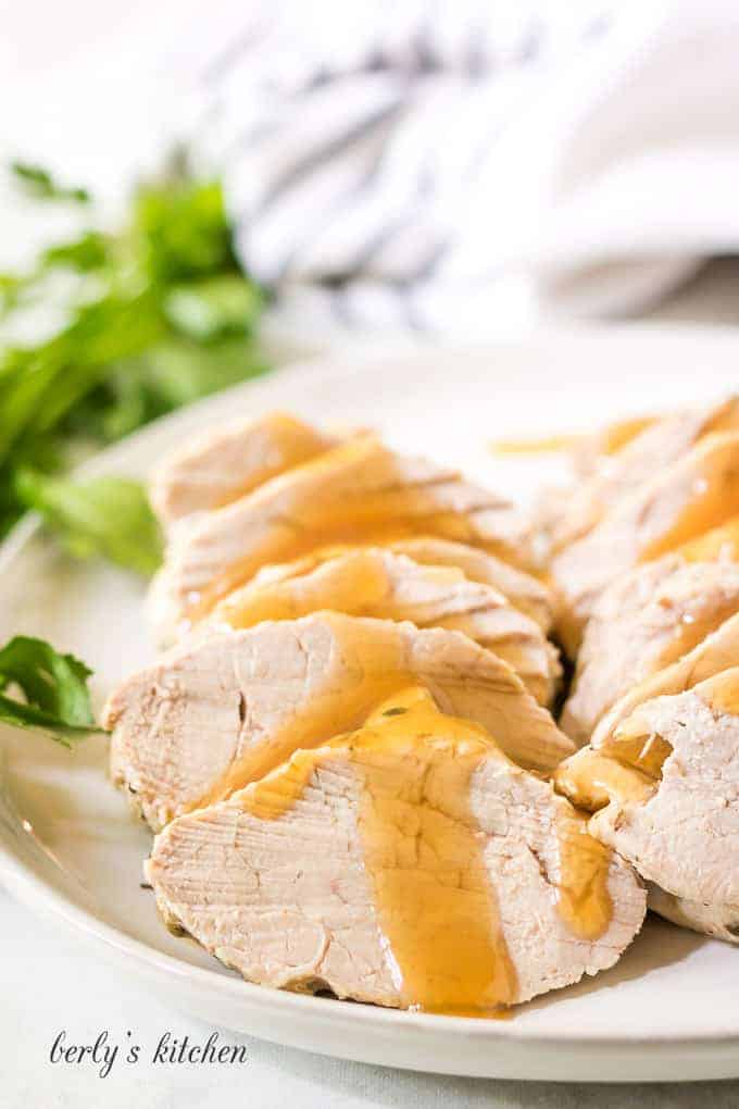 Sliced meat covered in a sweet and savory honey glaze.