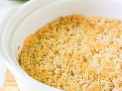 The finished popper dip served in a white casserole dish.