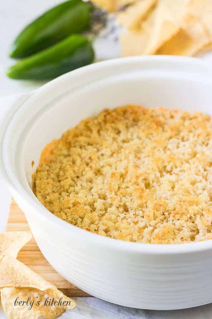 The finished popper dip served in a white casserole dish.