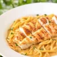 A close up view of the spicy chicken pasta in a large bowl.