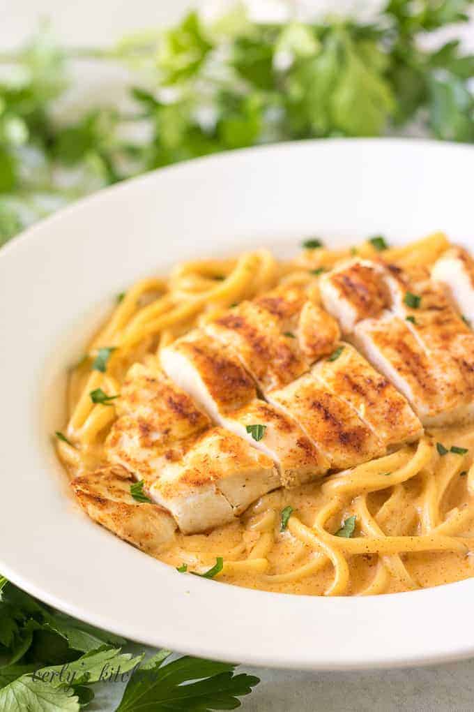 A close up view of the spicy chicken pasta in a large bowl.