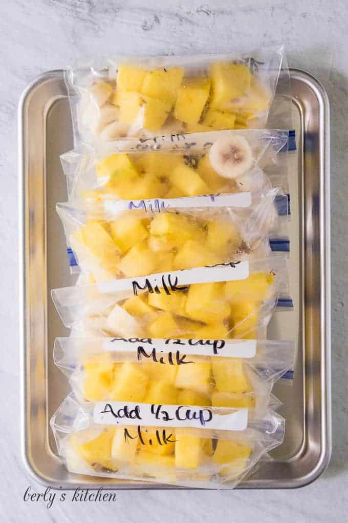 The fruit has been portioned out into small freezer bags.