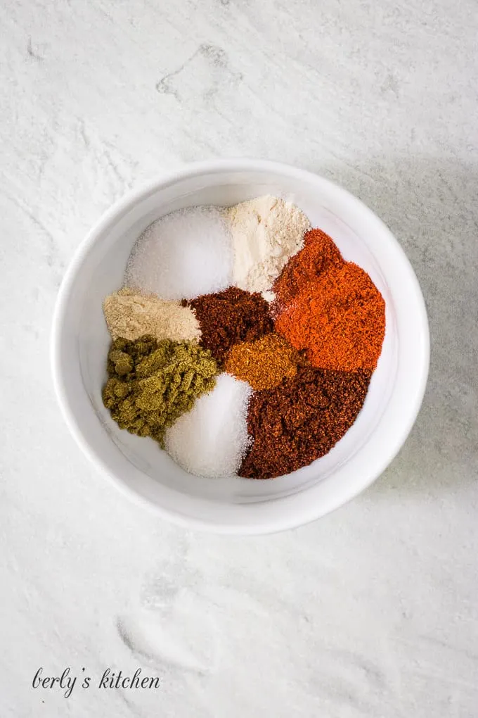All of the different spices separated on a small plate.
