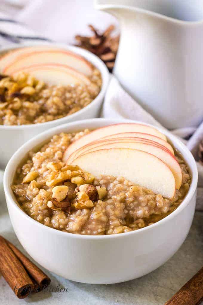 The finished steel cut oats topped with sliced apples.