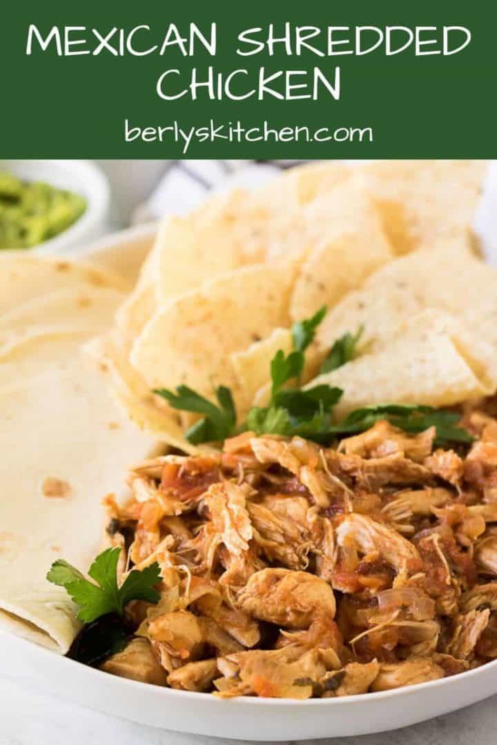The pressure cooker mexican chicken garnished with tortillas and cilantro.