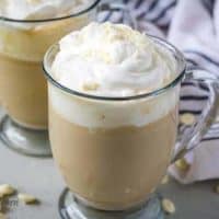 The white chocolate mocha in a mug with whipped cream.
