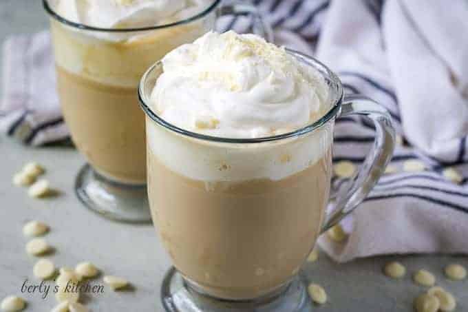 The white chocolate mocha in a mug with whipped cream.