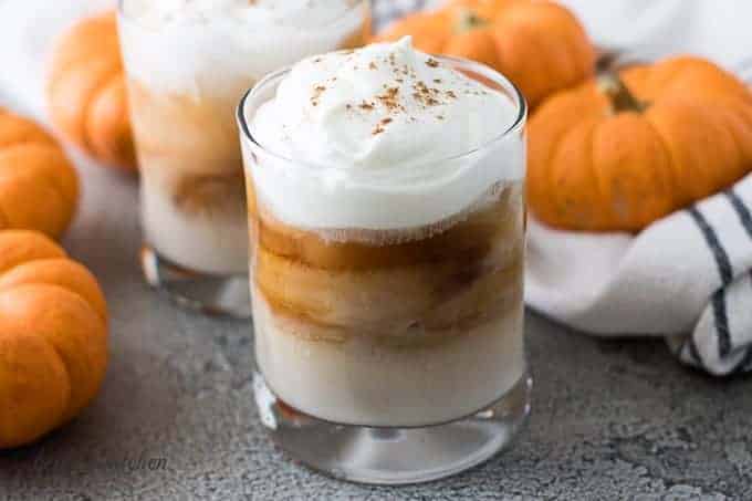 The finished pumpkin spice white russian topped with whipped cream.