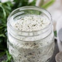 A small mason jar filled with homemade ranch dry mix.