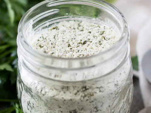 A small mason jar filled with homemade ranch dry mix.