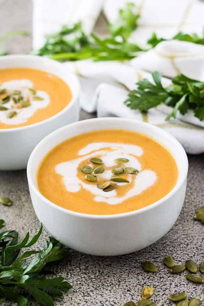 The instant pot acorn squash soup drizzled with coconut milk.