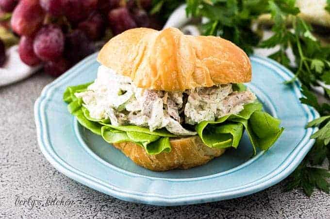 The turkey salad served on a flaky croissant with lettuce.