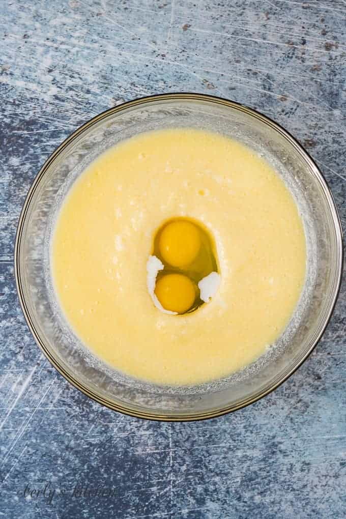 Eggs, milk, and other wet ingredients in a mixing bowl.