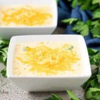 The Instant Pot broccoli cheese soup served in square bowls.