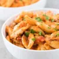 A close-up photo of the finished pasta topped with parsley.