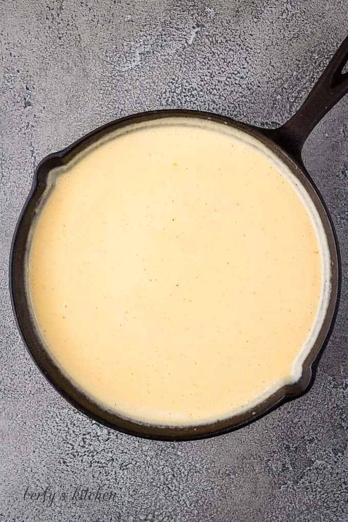 Shredded cheese whisked into the cream mixture to make a cheese sauce.