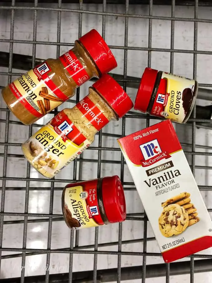 Vanilla and other spices sitting in a large shopping cart.