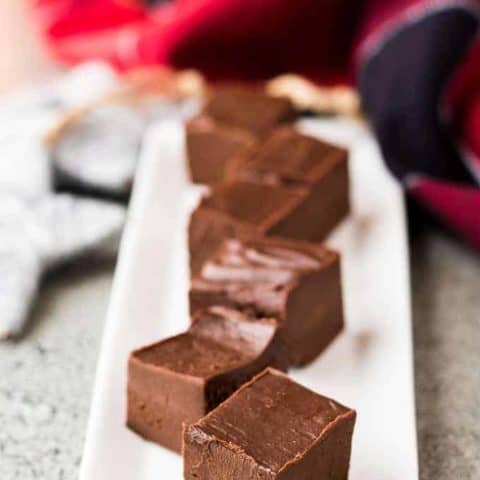 Multiple pieces of Irish cream fudge on a decorative plate.