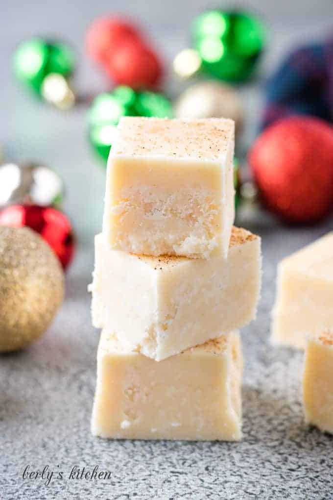 The finished eggnog fudge stacked on a counter-top.