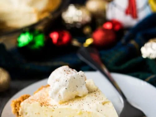 A serving of the eggnog pie topped with whipped topping.