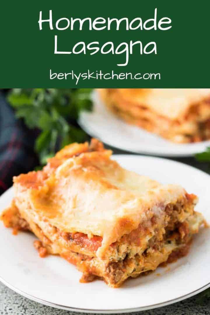 Two squares of the lasagna served on small white plates.