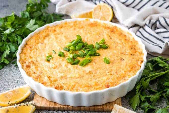 The hot crab dip baked in a white tart pan.