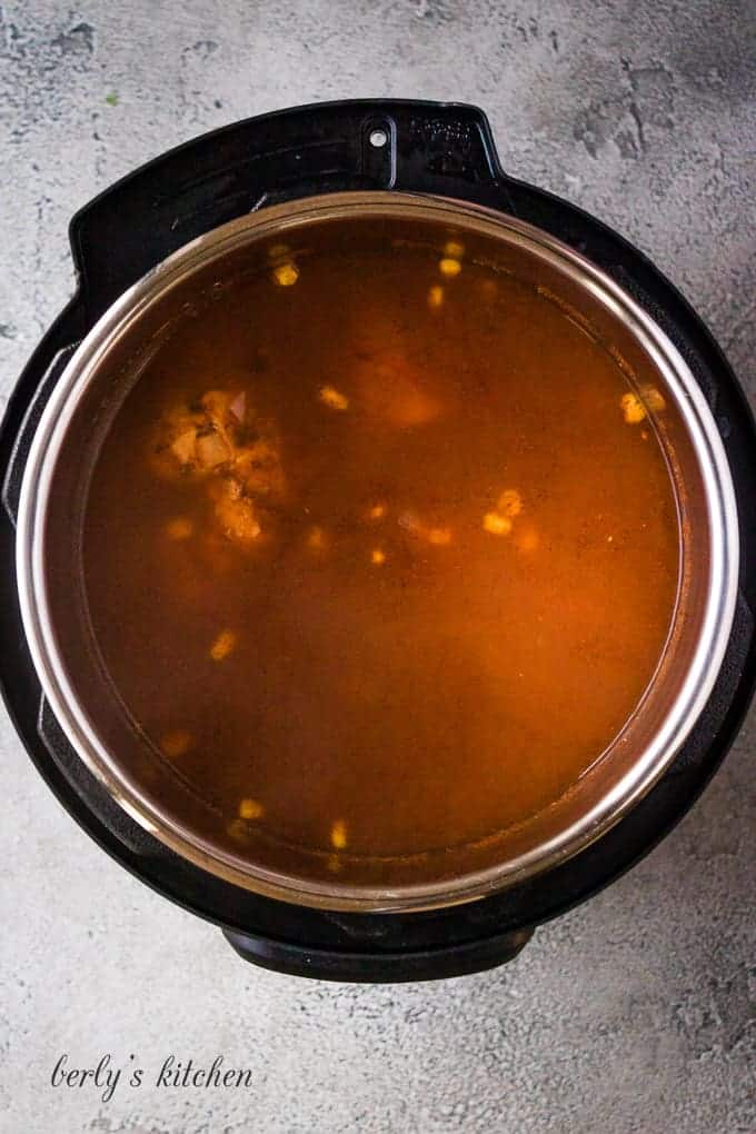 The lid has been removed to show the cooked soup.