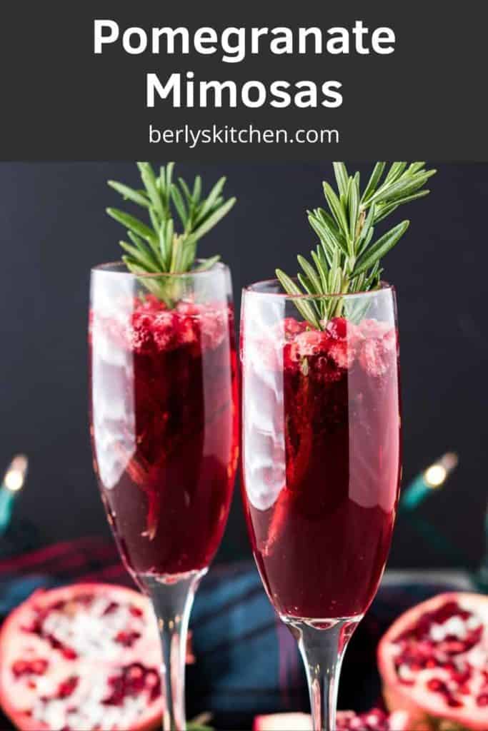 The pomegranate mimosas garnished with a sprig of fresh rosemary.