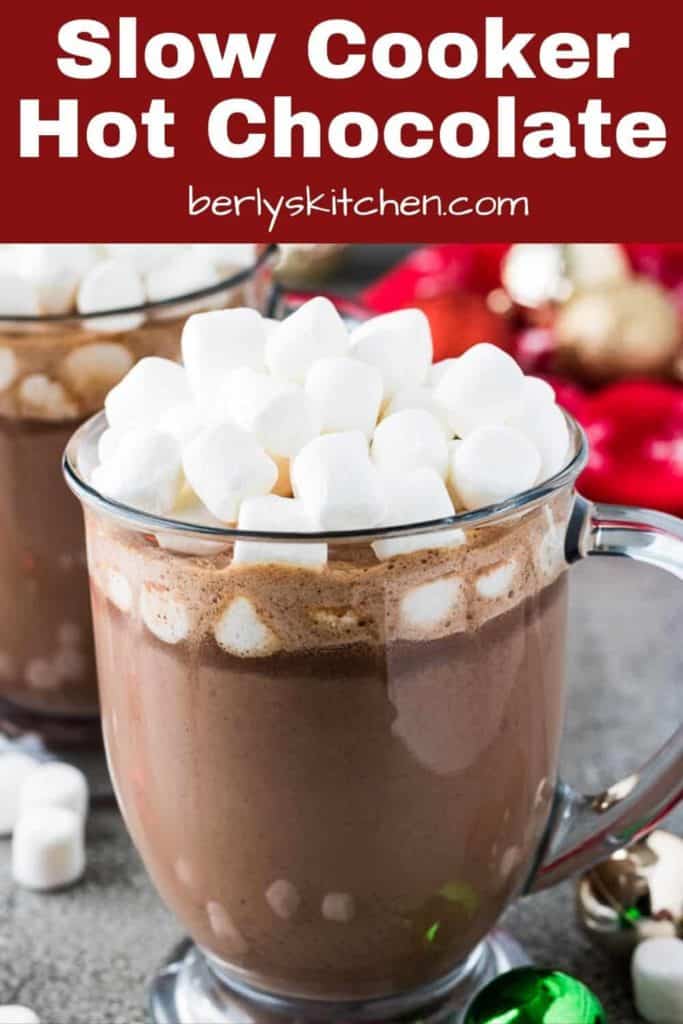 A mug with slow cooker hot chocolate topped with marshmallows.
