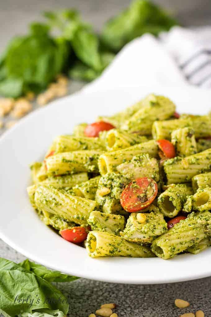 The finished chicken pesto pasta in a large decorative bowl.