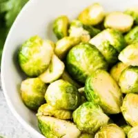 A close-up view of the buttered sprouts in a bowl.