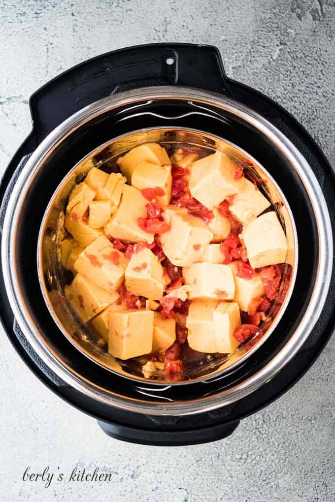 The metal bowl with ingredients, transferred to the pressure cooker.