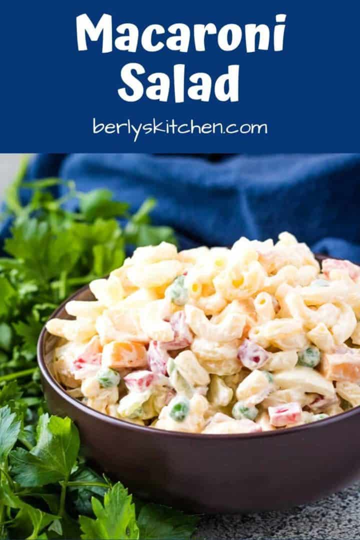 The finished macaroni salad recipe in a decorative brown bowl.