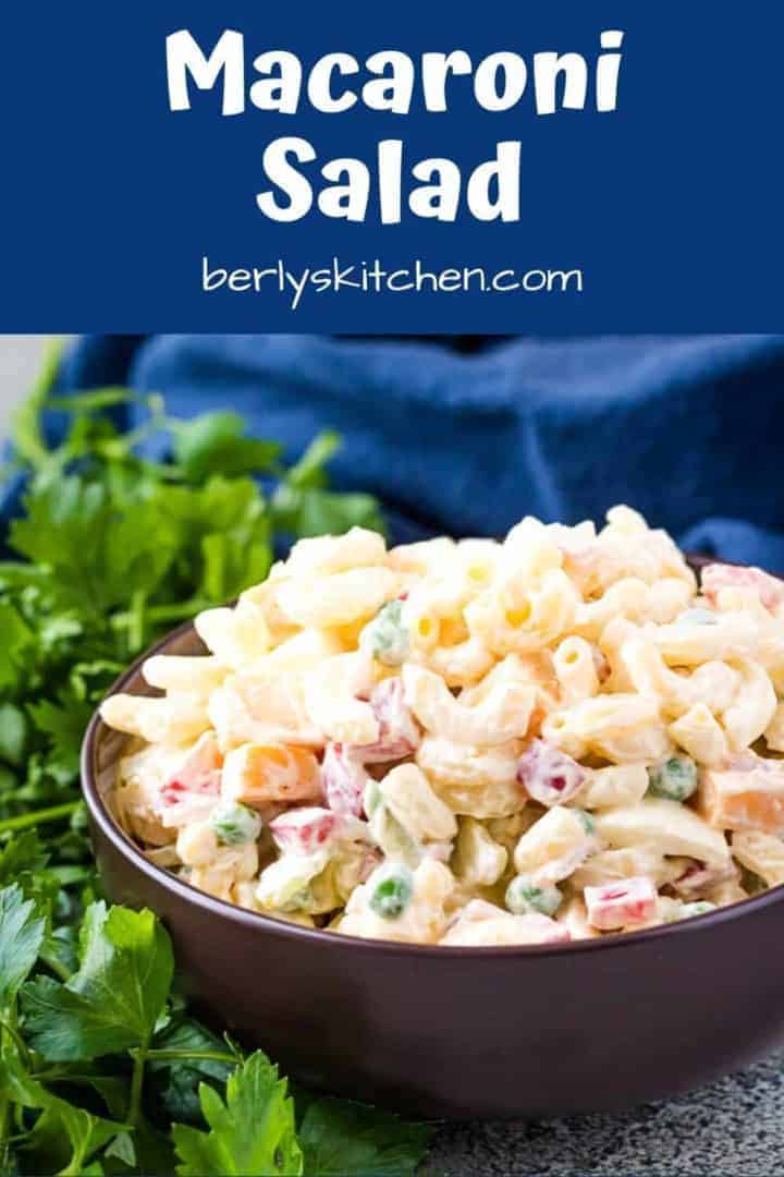 The finished macaroni salad recipe in a decorative brown bowl.