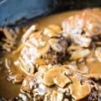 A close up of the finished Salisbury steaks with gravy.