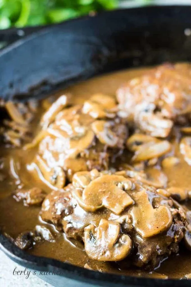 A close up of the finished Salisbury steaks with gravy.